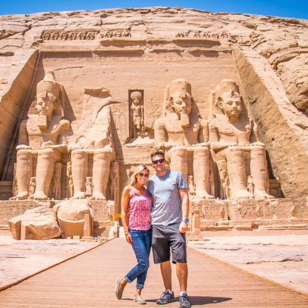 A-wonderful-shot-of-a-couple-in-front-of-the-facade-of-the-wonderful-Abu-Simbel-Temple-in-Aswan